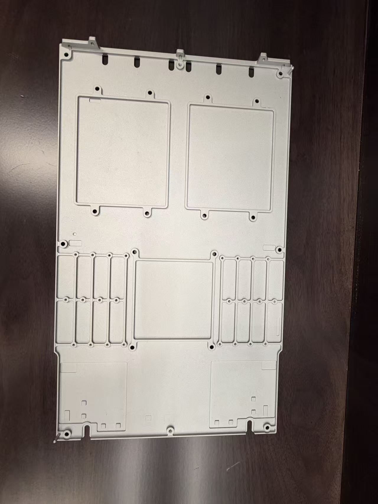 Stamped motherboard support plate